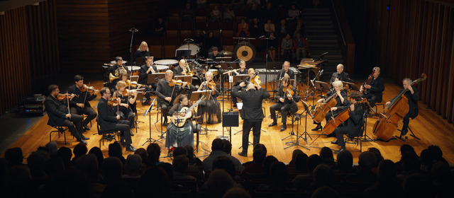 With large orchestra